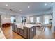 Open concept kitchen and living area with large island and hardwood floors at 1525 Kepley Dr, Mount Pleasant, SC 29464