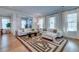 Open concept living room with hardwood floors and sectional sofa at 1525 Kepley Dr, Mount Pleasant, SC 29464