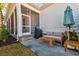 Relaxing patio with covered seating, grill, and umbrella at 1525 Kepley Dr, Mount Pleasant, SC 29464