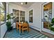 Relaxing screened porch with wooden dining set and plants at 1525 Kepley Dr, Mount Pleasant, SC 29464