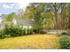 Landscaped backyard with storage shed and privacy fence at 1654 Sparkleberry Ln, Johns Island, SC 29455