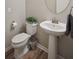 Small bathroom with pedestal sink and updated fixtures at 1654 Sparkleberry Ln, Johns Island, SC 29455