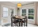 Cozy breakfast nook with table and chairs near French doors at 1654 Sparkleberry Ln, Johns Island, SC 29455