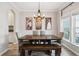 Dining room with a rustic wood table and chandelier at 1654 Sparkleberry Ln, Johns Island, SC 29455