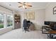 Bright home office features built-in shelving and ample natural light at 1654 Sparkleberry Ln, Johns Island, SC 29455