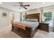 Spacious main bedroom with a large bed, ensuite bathroom access, and plenty of natural light at 1654 Sparkleberry Ln, Johns Island, SC 29455