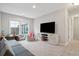 Bright playroom features built-in seating, a large TV, and plenty of space for toys at 1654 Sparkleberry Ln, Johns Island, SC 29455