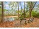 Serene pond view with wooden benches at 1654 Sparkleberry Ln, Johns Island, SC 29455