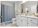 Bathroom with white vanity and gray shower curtain at 2020 Parish House Cir, Johns Island, SC 29455