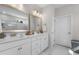 Elegant bathroom with double vanity, marble tile, and a large walk-in shower at 2020 Parish House Cir, Johns Island, SC 29455