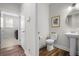 Stylish powder room featuring a pedestal sink and framed art at 2020 Parish House Cir, Johns Island, SC 29455