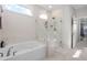 Relaxing bathroom with a soaking tub and a separate walk-in shower with marble surround at 2020 Parish House Cir, Johns Island, SC 29455