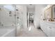 Spa-like bathroom featuring a soaking tub, walk-in shower, and marble finishes at 2020 Parish House Cir, Johns Island, SC 29455