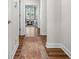 Bright hallway with hardwood floors and view of living area at 2020 Parish House Cir, Johns Island, SC 29455