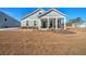 Gray house with brown lawn and porch at 2020 Parish House Cir, Johns Island, SC 29455