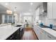 Modern kitchen with a large island, white cabinets, and stainless steel appliances at 2020 Parish House Cir, Johns Island, SC 29455