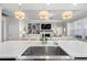 Modern kitchen island with a sink and view of the living room at 2020 Parish House Cir, Johns Island, SC 29455