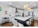 White kitchen with island, stainless steel appliances, and quartz countertops at 2020 Parish House Cir, Johns Island, SC 29455