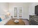Living room with French doors and a view to another room at 2020 Parish House Cir, Johns Island, SC 29455