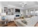 Spacious living room with a cozy fireplace and built-in shelving at 2020 Parish House Cir, Johns Island, SC 29455