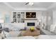 Spacious living room with a cozy fireplace and built-in shelving at 2020 Parish House Cir, Johns Island, SC 29455