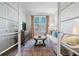 Light-filled living room with comfortable sofa and French doors at 2020 Parish House Cir, Johns Island, SC 29455