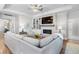 Spacious living room with a cozy fireplace and built-in shelving at 2020 Parish House Cir, Johns Island, SC 29455