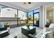 Enjoy outdoor living in this spacious screened porch with seating area at 2020 Parish House Cir, Johns Island, SC 29455