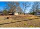 Large backyard with storage shed and fire pit at 204 Palmetto St, Moncks Corner, SC 29461