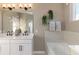 Elegant bathroom with double vanity, soaking tub, and separate shower at 218 Yorkshire Dr # 2, Moncks Corner, SC 29461