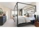 Main bedroom with canopy bed, carpeted floors, and large windows at 218 Yorkshire Dr # 2, Moncks Corner, SC 29461