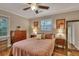 Bedroom with hardwood floors, a double bed, and mid century furniture at 2216 S Dallerton Cir, Charleston, SC 29414