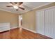 Bedroom with hardwood floors and double doors leading to a hallway at 2216 S Dallerton Cir, Charleston, SC 29414