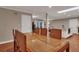 Bright dining area with hardwood floors and view into kitchen and living areas at 2216 S Dallerton Cir, Charleston, SC 29414
