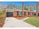 Brick ranch house with a two-car garage and well-maintained landscaping at 2216 S Dallerton Cir, Charleston, SC 29414
