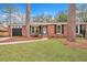 Brick ranch home with a 2-car garage and nicely landscaped yard at 2216 S Dallerton Cir, Charleston, SC 29414