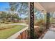 Inviting front porch with ornate railing, offering a peaceful view of the street at 2216 S Dallerton Cir, Charleston, SC 29414
