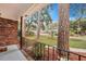 Inviting front porch with view of the tree-lined street at 2216 S Dallerton Cir, Charleston, SC 29414