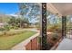 A welcoming front porch with an ornate railing overlooking the beautifully landscaped yard at 2216 S Dallerton Cir, Charleston, SC 29414