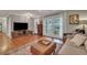 Living room with hardwood floors, large windows, and comfy seating at 2216 S Dallerton Cir, Charleston, SC 29414