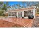Sunroom addition with brick patio and grill at 2216 S Dallerton Cir, Charleston, SC 29414