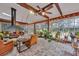 Spacious sunroom features brick floors, a fireplace, and ample natural light at 2216 S Dallerton Cir, Charleston, SC 29414