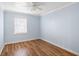 Empty bedroom with hardwood floors and light blue walls at 2383 Erskine Ct, Charleston, SC 29414