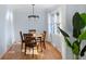 Dining room with round table and chairs, hardwood floors and large window at 2383 Erskine Ct, Charleston, SC 29414