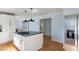 Kitchen with island, stainless steel appliances, and access to hallway at 2383 Erskine Ct, Charleston, SC 29414