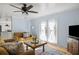Open living space with double doors and light blue walls at 2383 Erskine Ct, Charleston, SC 29414