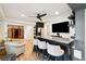 Basement bar with seating, modern cabinetry, and a large TV at 2737 Sarazen Dr, Mount Pleasant, SC 29466