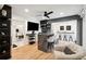 Open concept basement with a wet bar, seating area, and hardwood floors at 2737 Sarazen Dr, Mount Pleasant, SC 29466