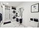Modern bathroom with marble tile, walk-in shower, and laundry at 2737 Sarazen Dr, Mount Pleasant, SC 29466