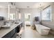 Elegant bathroom boasting double vanities, a freestanding tub, and a walk-in shower at 2737 Sarazen Dr, Mount Pleasant, SC 29466